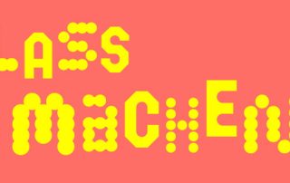 Der Text "Lass machen" in gelber Schrift vor rotem Hintergrund